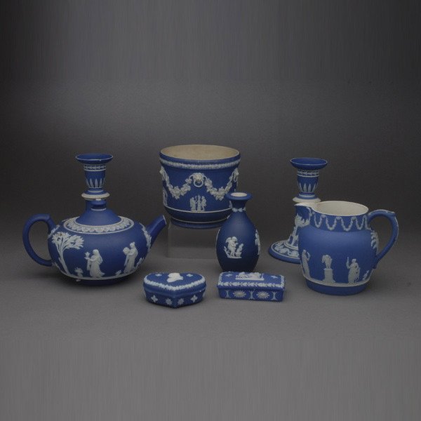 Eight Wedgwood Jasperware Table Decorations: Eight Wedgwood Jasperware Table Decorations: a pair of candlesticks; a vase; a pitcher; an urn; a teapot (spout chipped); and two boxes {Height of candlesticks 6 1/4 inches}