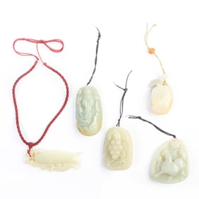 Collection of Five Carved Celadon Jade Pendants.