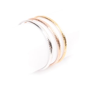 Three 14k Tricolor Gold Stacking Bracelets.