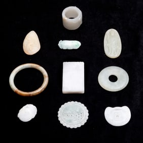 Group of Ten Assorted Chinese Caved Jade Pendants