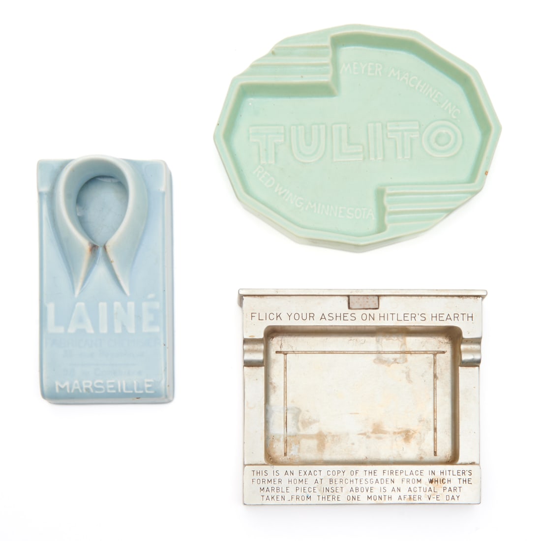 Three Vintage Ashtrays Including Hitler's Hearth: Three Vintage Ashtrays Including Hitler's Hearth. Comprising "FLICK YOUR ASHES ON HITLER'S HEARTH" metal ashtray, ceramic "TULITO MEYER MACHINE INC" advertising ashtray, ceramic "LAINE MARSEILLE" shir