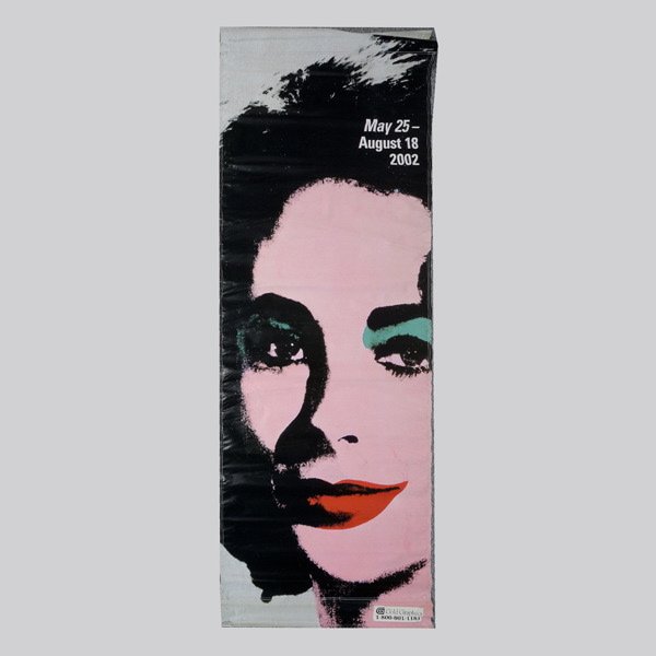 Liz Taylor Image/Andy Warhol Image Banner: Liz Taylor Image/Andy Warhol Image Banner. Banner displays Liz Taylor's image on heavy-duty vinyl, Andy Warhol's banner image for Andy Warhol Exhibit Moca Retrospective May 25th-August 8th, 2002. Dime