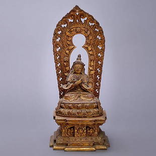 A Gilt-Painted & Lacquered Wood Carving of Maitre: A Gilt-Painted and Lacquered Wood Carving of Maitreya, Seated in dhyanasana on a double lotus base with beaded rim, his hands in dharmacakra mudra and holding ta vajra, wearing a long dhoti, beaded be