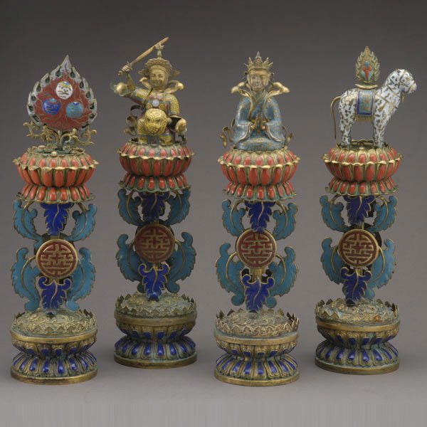 A Partial Set of Four Enameled Buddhist Emblems: A Partial Set of Four Enameled Buddhist Emblems, All supported on a tiered enameled double-lotus bases and flanked by curling leaves, each emblem executed in cloisonnŽ enamels, including two Buddhist