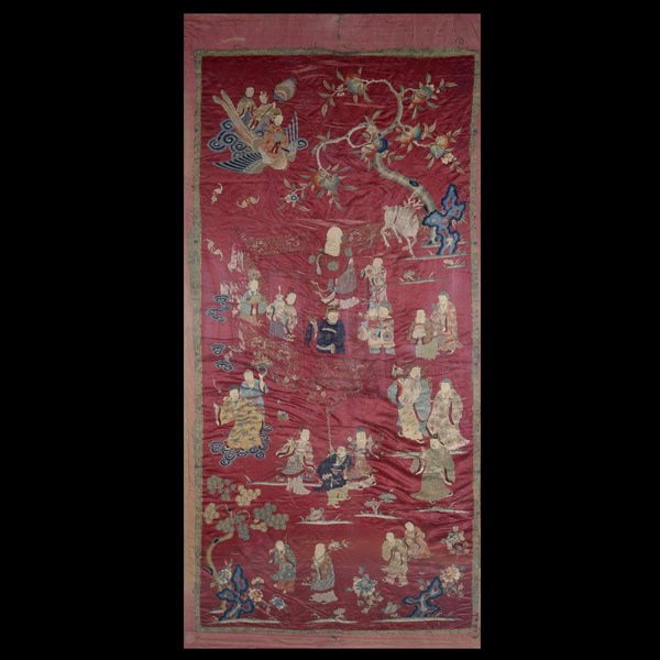 A Large Embroidered Silk Figural Panel, 19th C: A Large Embroidered Silk Figural Panel, Of vertical format, embroidered in silk and metallic-wrapped threads to a deep red ground with a busy garden compound scene filled with figures and bats in flig