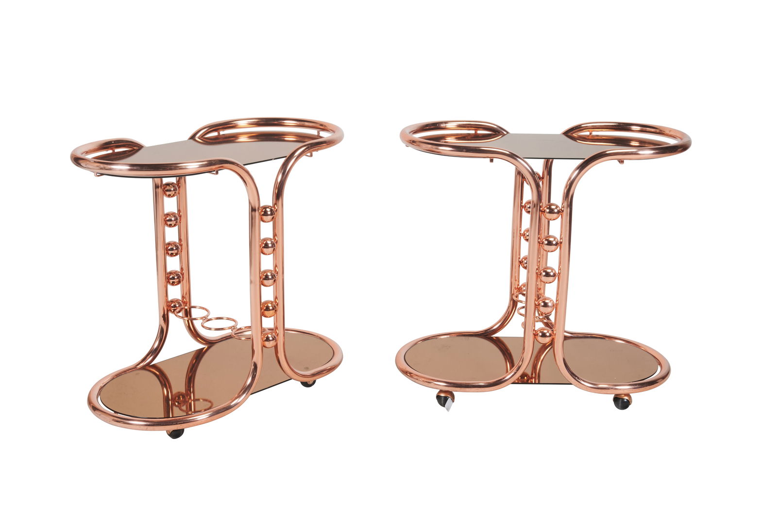 Pair of Jonathan Adler Mirrored Copper Bar Carts: Pair of Jonathan Adler Mirrored Copper Bar Carts. Copper finish bodies with copper tinted mirrors to top and base. {Approximate dimensions: 31 1/2" high x 33" wide x 17 1/2" deep.}. Condition: Some su