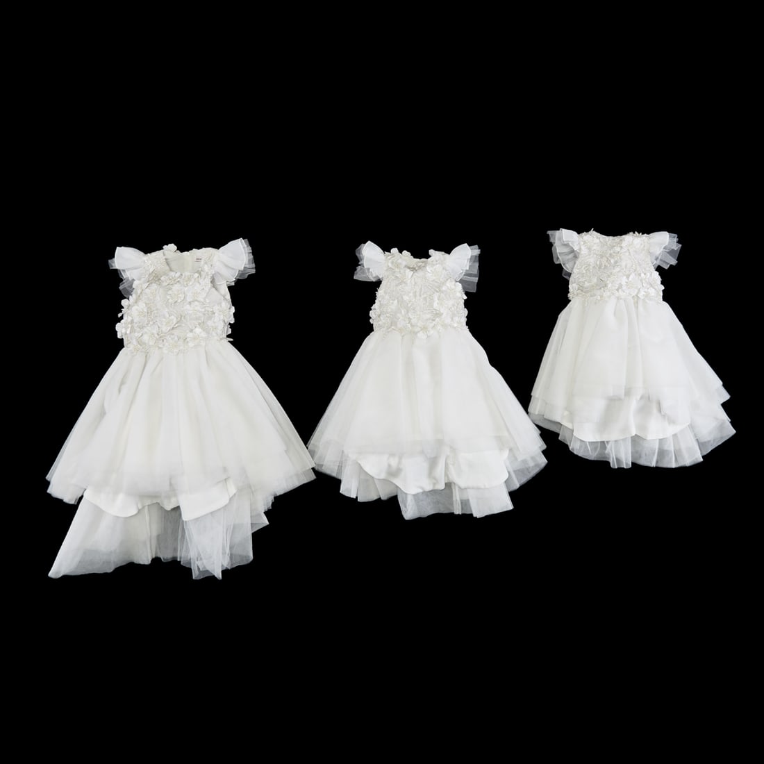Three Little Miss Aoki Youth White Party Dresses.: Three Little Miss Aoki Youth White Party Dresses. Cap sleeve tulle, cotton lined dress in sizes 4, 8 and 10. Bodices embellished with laser-cut flowerheads, with pearl decorations, on laser lacy shell