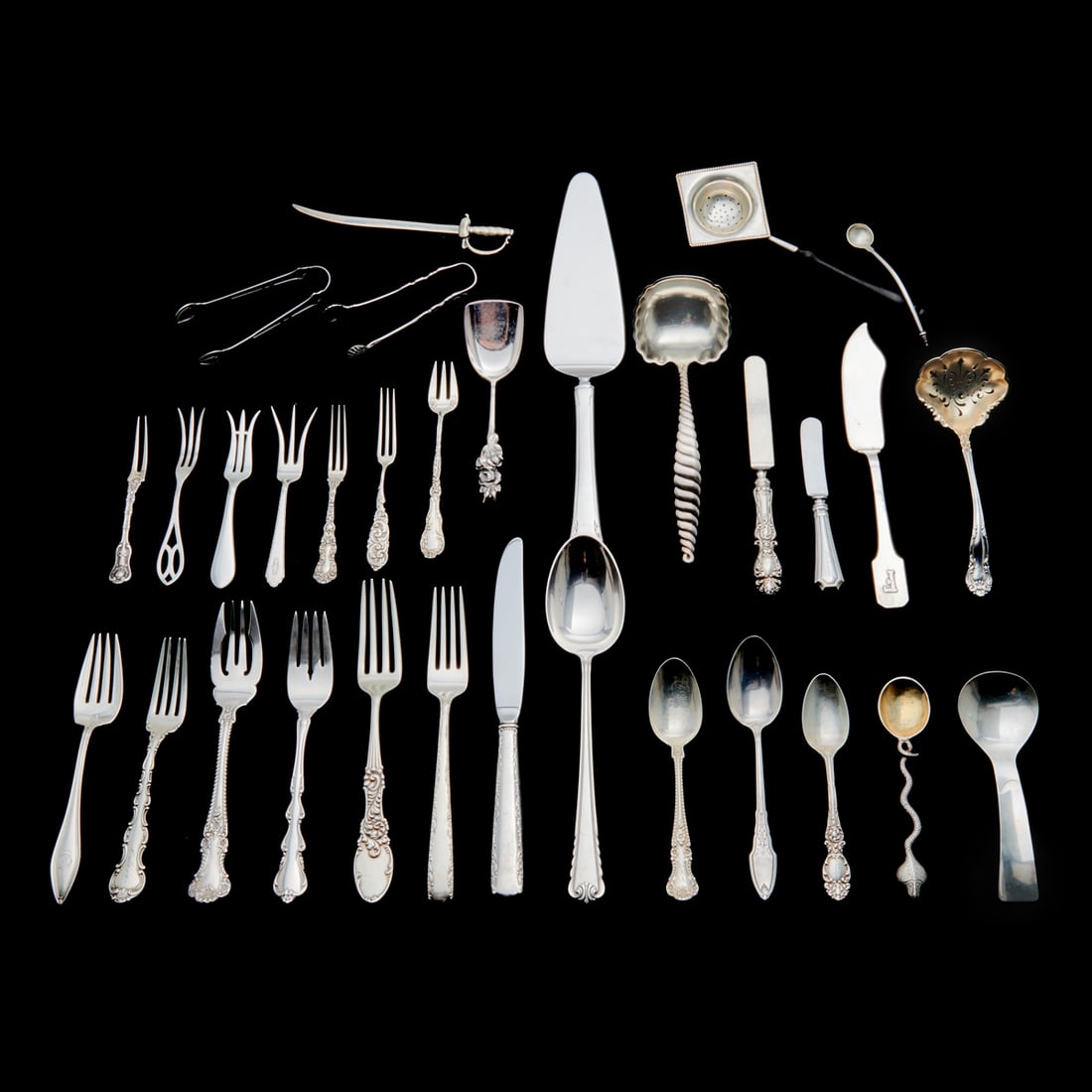 Collection of Miscellaneous Sterling Silver Flatware: Collection of Miscellaneous Sterling Silver Flatware. 69 pieces total; includes 3 English 1834 William Eaton place forks, 12 Frank Smith seafood forks, 7 Gorham berry forks, Allan Adler spoon; also wi