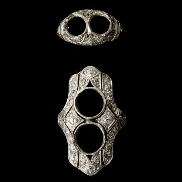 COLLECTION OF TWO DIAMOND, PLATINUM SEMI MOUNTINGS: COLLECTION OF TWO DIAMOND, PLATINUM SEMI MOUNTINGS. Including one diamond, platinum two stoned, lozenge shaped semi mounting, size 5 3/4 together with one platinum two stone mounting, size 5 1/4. Note