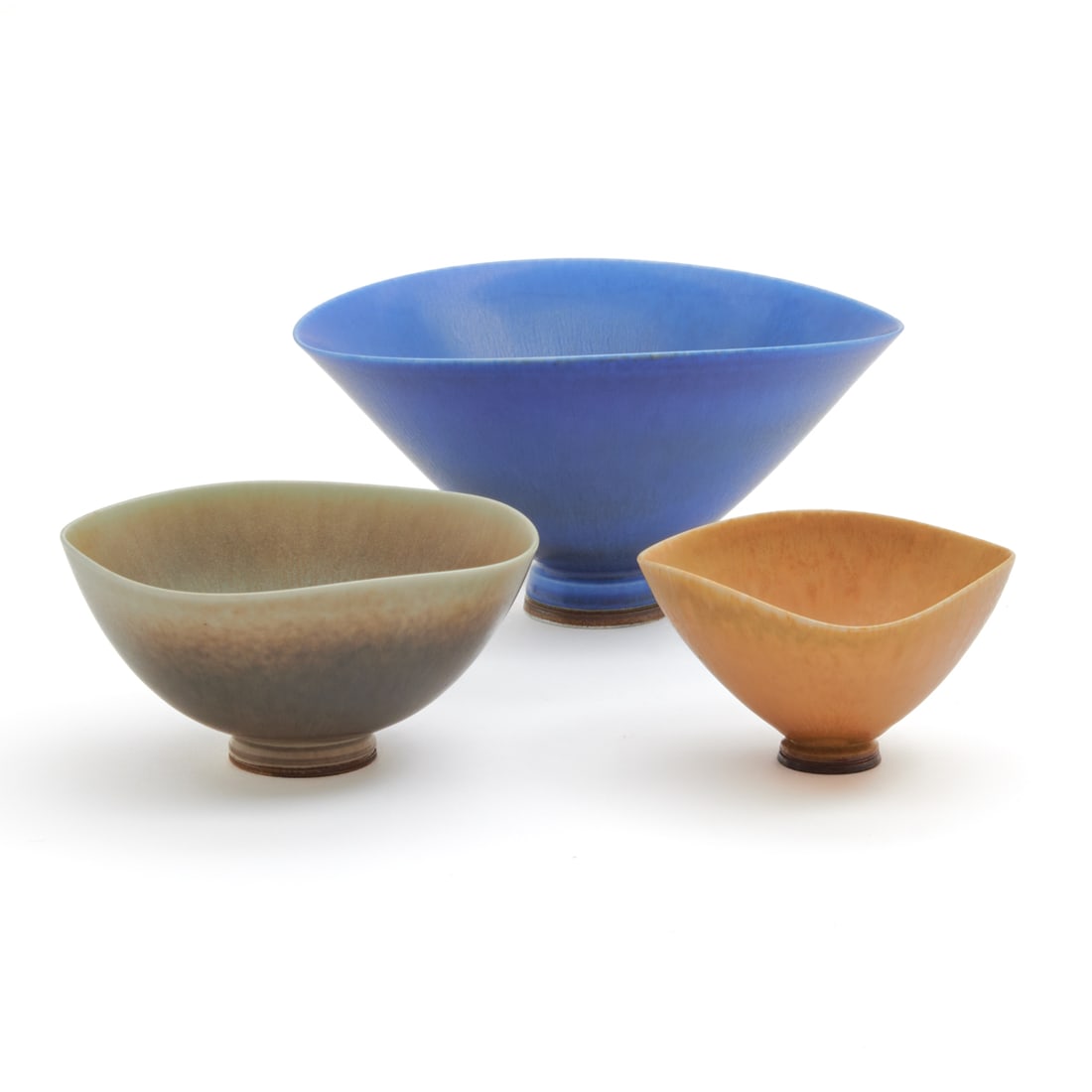 Three Berndt Friberg Studio Pottery Bowls: Three Berndt Friberg Studio Pottery Bowls. Berndt Friberg (Swedish, 1899-1981); comprising blue example, pale green example, and light brown example. All three with incised marks to the underside. {Ap