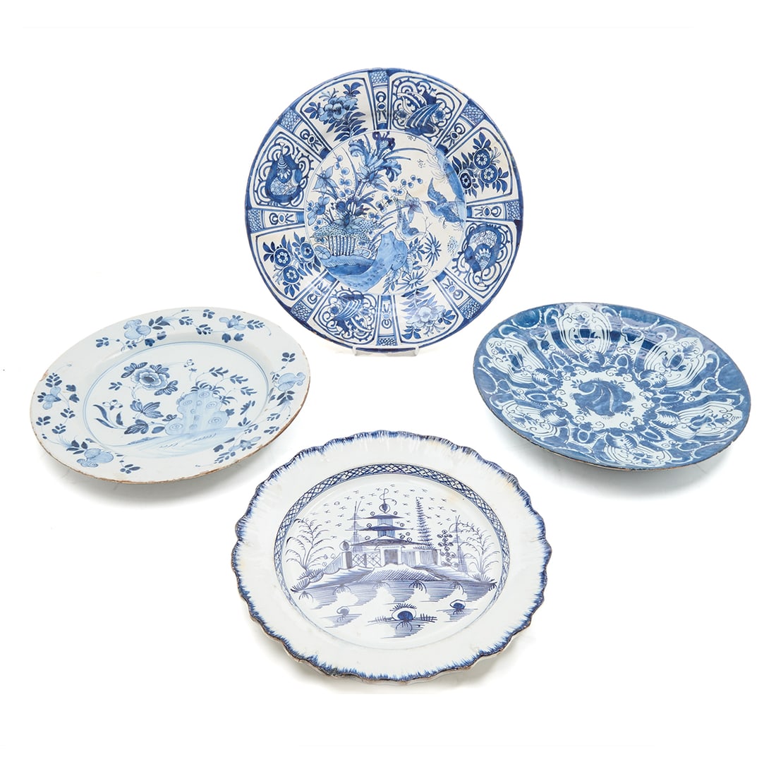 Four 18th Century European Chargers: Four 18th Century European Chargers. A German Frankfurt faience blue and white example, painted after an Arita original, an English China White pearlware charger painted in the House pattern under she