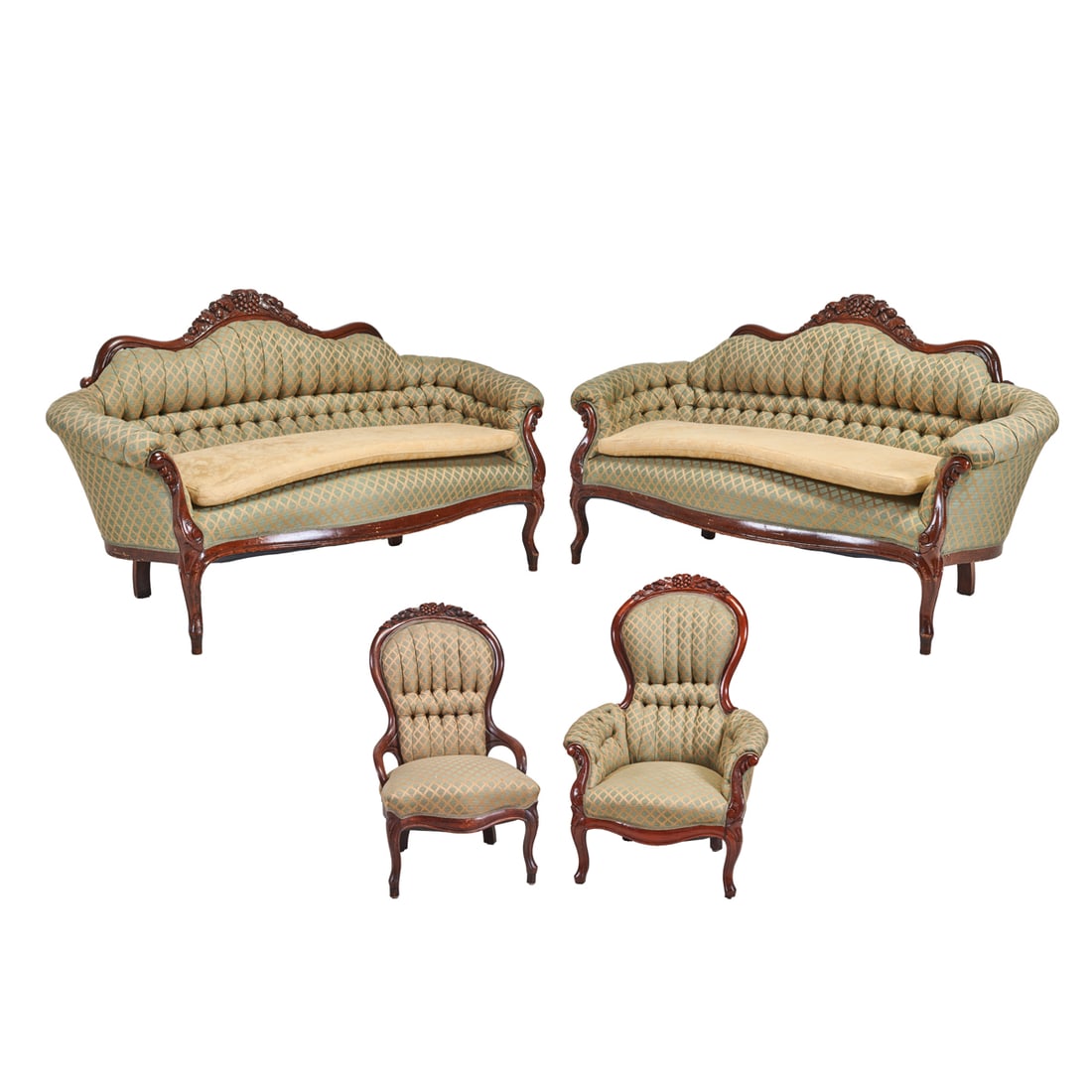 Victorian Style Mahogany Salon Suite: Victorian Style Mahogany Salon Suite. Comprising two settees, armchair, and parlor chair; carved mahogany frames with gold on green grid pattern upholstery; settees with custom additional seat cushion