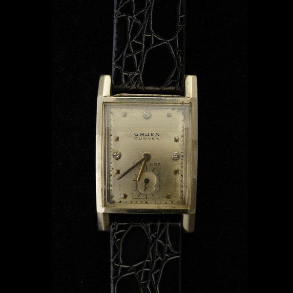 GRUEN 14K WHITE GOLD, LEATHER WRISTWATCH.: GRUEN 14K WHITE GOLD, LEATHER WRISTWATCH. DIAL: Rectangular, silvered, applied pyramidal hour markers, sunken subsidiary seconds dial at 6 O'clock, baton hands, Gruen Curvex. MOVEMENT: Seventeen jewel