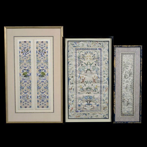 Three Embroidered Panels: Three Embroidered Panels, two depicting figures within a garden setting with the third showing peacocks, butterflies and flowers; each framed and glazed {Largest: 31 x 18 1/2 inches (78.7 x 46.9 cm) o