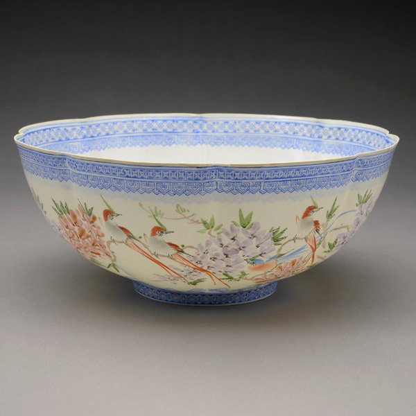 An Enamel-Painted Eggshell Porcelain Bowl: An Enamel-Painted Eggshell Porcelain Bowl, of lobed form decorated with birds and wisteria to the exterior, the interior with a blue dragon medallion to the floor, a mark to the base {Diameter: 10 3/4