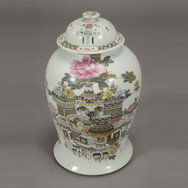 A Covered Ginger Jar: A Covered Ginger Jar, painted with flowers and antiquities reversed by an inscription {Height: 17 inches (43.2 cm)} [Drilled holes to lid and base, chips, abrasions, small hairline cracks to the rim]