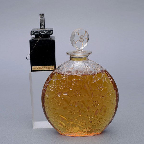 Two French Perfume Bottles: Two French Perfume Bottles: "Mystere d'Orsay" and another large flacon with molded floral decoration {Height of taller 7 inches}