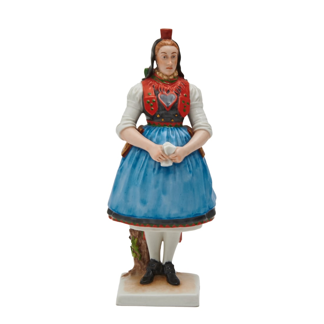 Allach Porcelain Figure: Allach Porcelain Figure. Modeled by Richard Foerster of the Bueckeberg Female in traditional garb, painted in polychrome enamels and gilding. Green stylized SS and allach in an octagon to underside, i