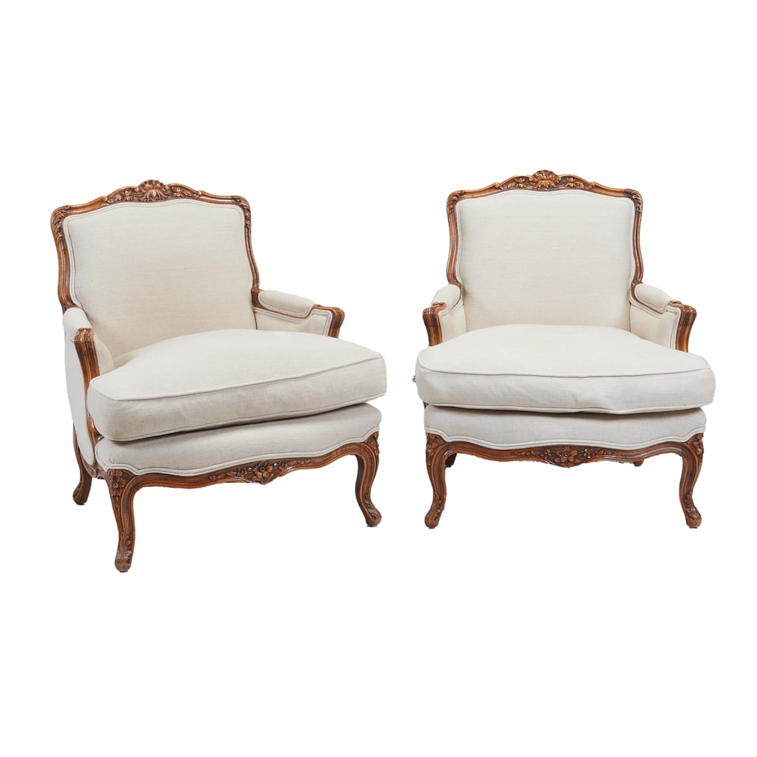 Pair of Louis XV Provincial Style Bergeres: Pair of Louis XV Provincial Style Bergeres. Carved frames with canvas upholstery. {Approximate dimensions: 35 1/2" high x 31" wide x 31" deep.}. Condition: Frames with some patina and surface wear. Up