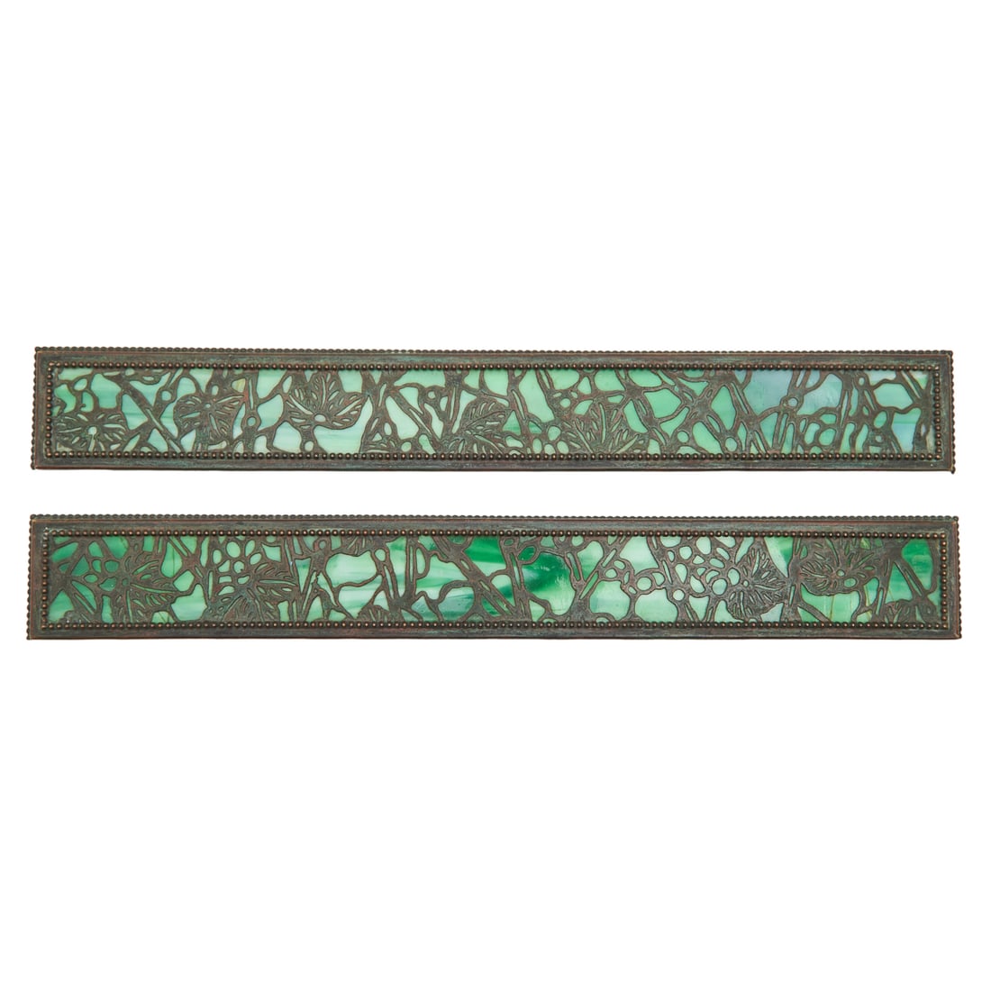Pair of Riviere Studios Bronze Grapevine Blotter Ends: Pair of Riviere Studios Bronze Grapevine Pattern Blotter Ends. Bronze bookends with green slag glass panels. {Approximate dimensions: 16 1/4" long x 2 1/4" wide.}. Condition: Patina and surface wear t