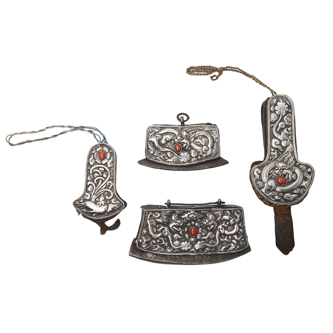 Group of Four Tibetan Flint Pouches and Needle Cases: Group of Four Tibetan Flint Pouches and Needle Cases. Comprising: one flint pouch with steel blades, the surface decorated with repousse carvings of two dragons and lucky clouds encircling the central
