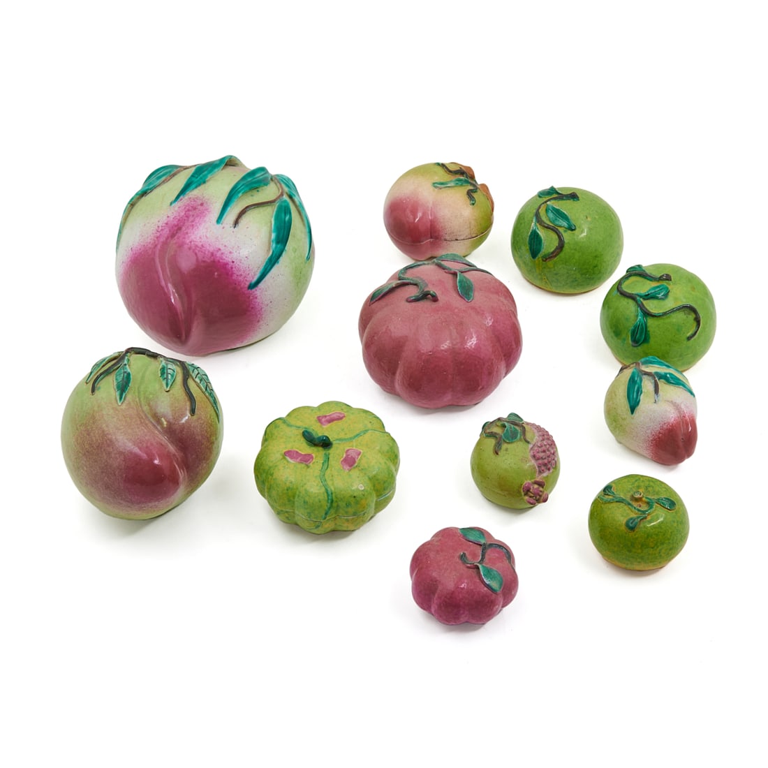 Eleven Chinese Famille Rose Porcelain Fruits: Lot of Eleven Chinese Famille Rose Porcelain Fruits. Each polychrome enamel decorated and modeled in peaches, pomegranate, melons, and tangerines, one peach and melon molded as boxes with turquoise gl