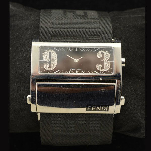 FENDI DIAMOND, STAINLESS STEEL WRISTWATCH.: FENDI DIAMOND, STAINLESS STEEL WRISTWATCH. DIAL: Horizontal rectangular, black applied Arabic numeral hour markers at 3 and 9 o'clock, outer white minutes track, silver tone baton hands. MOVEMENT: Qua