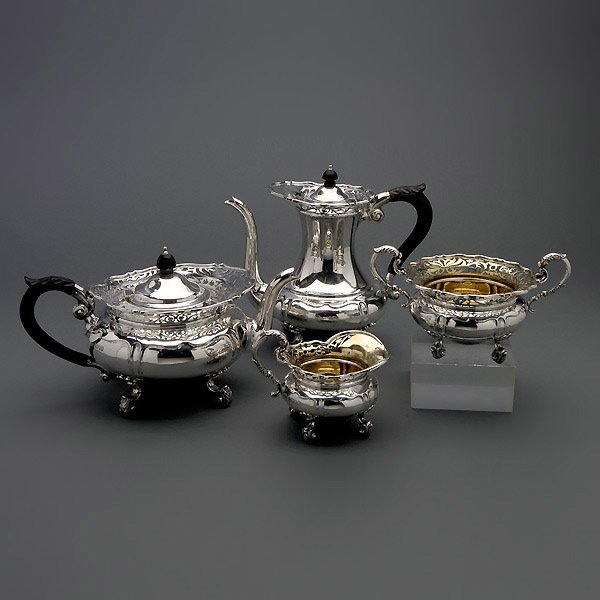 Edwardian Sterling 4 Piece Tea and Coffee Service: Edwardian Sterling Four Piece Tea and Coffee Service with Ebonized Wood Handles, Goldsmiths & Silversmiths Company, Ltd., 112 Regent Street, London, Circa 1906 {Total weight 72.774 troy oz; Height of 
