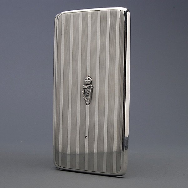 English Collins & Cook Sterling Cigar Box with Harp: English Art Deco Engine Turned Sterling Cigar Box with an Applied Harp, Collins & Cook, Birmingham, Circa 1915 {Total silver weight 8.77 troy oz; Length 6 inches}