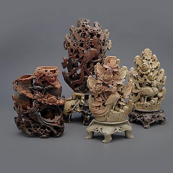 Four Large Soapstone Carvings: Four Large Soapstone Carvings, each depicting phoenixes and either peonies or chrysanthemums {Tallest: 15 3/4 inches (40 cm)} [Chips, small losses and cracks, the largest with possible repairs to crac