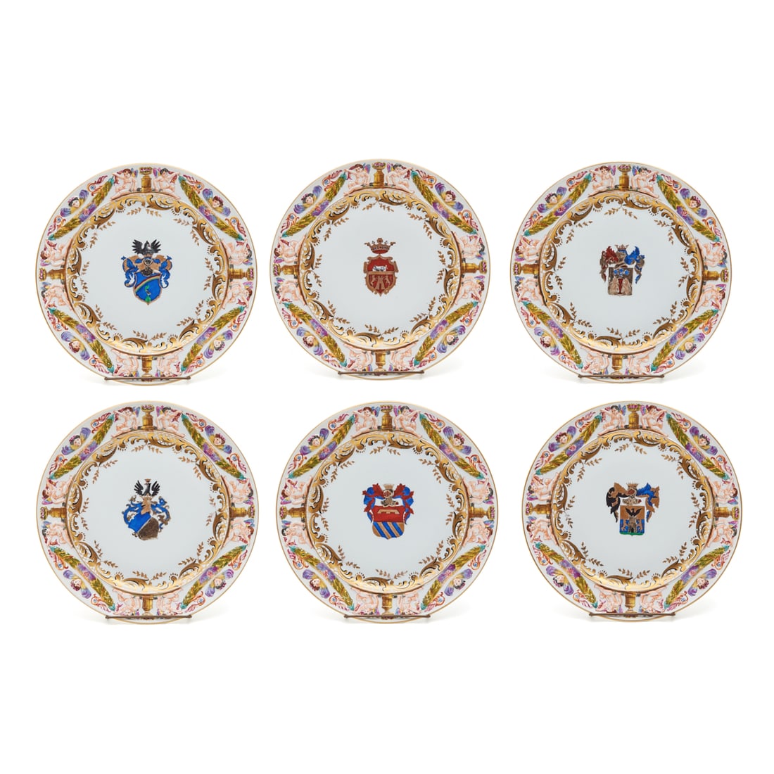 Six Capodimonte Armorial Dessert Plates: Six Capodimonte Armorial Dessert Plates. Each with different crest to the centers. The undersides with blue underglaze "Crown over N" marks. {Appproximate dimensions: 9 1/4" diameter.}. Condition: Ver