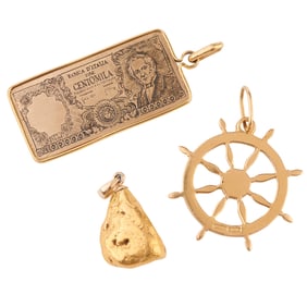 Collection of Three Yellow Gold Charms.