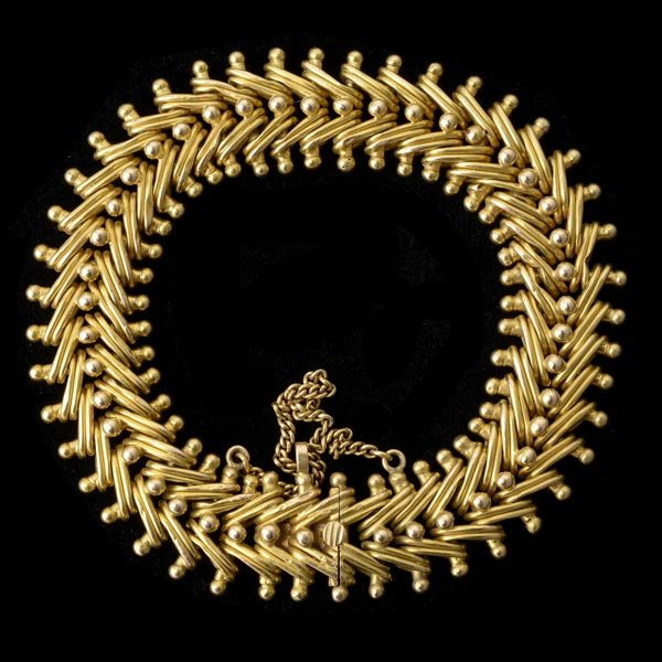 14K YELLOW GOLD BRACELET.: 14K YELLOW GOLD BRACELET. The fancy woven link measuring approximately 16.00 mm, completed by a tongue and groove clasp, forming an 8 inch bracelet with a safety chain. 30.1 dwts