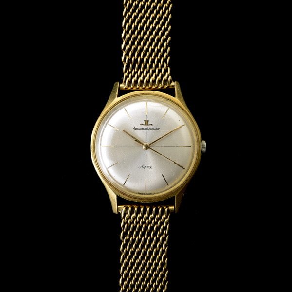 JAEGER LeCOULTRE 18K YELLOW GOLD WRISTWATCH.: JAEGER LeCOULTRE 18K YELLOW GOLD WRISTWATCH. DIAL: Round, silvered, quarter lined, gold tone baton hour markers, gold baton hands, center sweep seconds hand, Jaeger LeCoultre, Asprey. MOVEMENT: Mechan