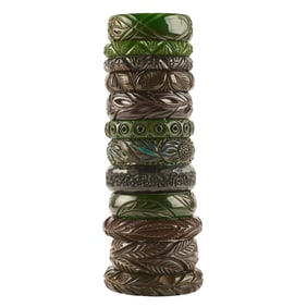 Collection of Twelve Green and Black Carved Bakelite Bracelets