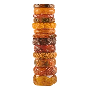 Collection of Thirteen Heavily Carved Earth-Tone Bakelite Bracelets