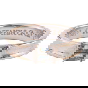 Tiffany & Co. Aquamarine, 18k White Gold Ring: Tiffany & Co. Aquamarine, 18k White Gold Ring. Featuring two baguette-cut aquamarines, set in an 18k white gold mounting. {Size: 6 1/2, Gross Weight: 3.4 dwts} Note: Inside shank marked "c 1997 Ti