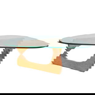 Isamu Noguchi Style Coffee Table: Isamu Noguchi Style Coffee Table. Asymmetrical triangular form glass top on folding mixed wood base. {Approximate dimensions: 15 3/4" high x 50 1/2" wide x 36 1/4" deep.}.