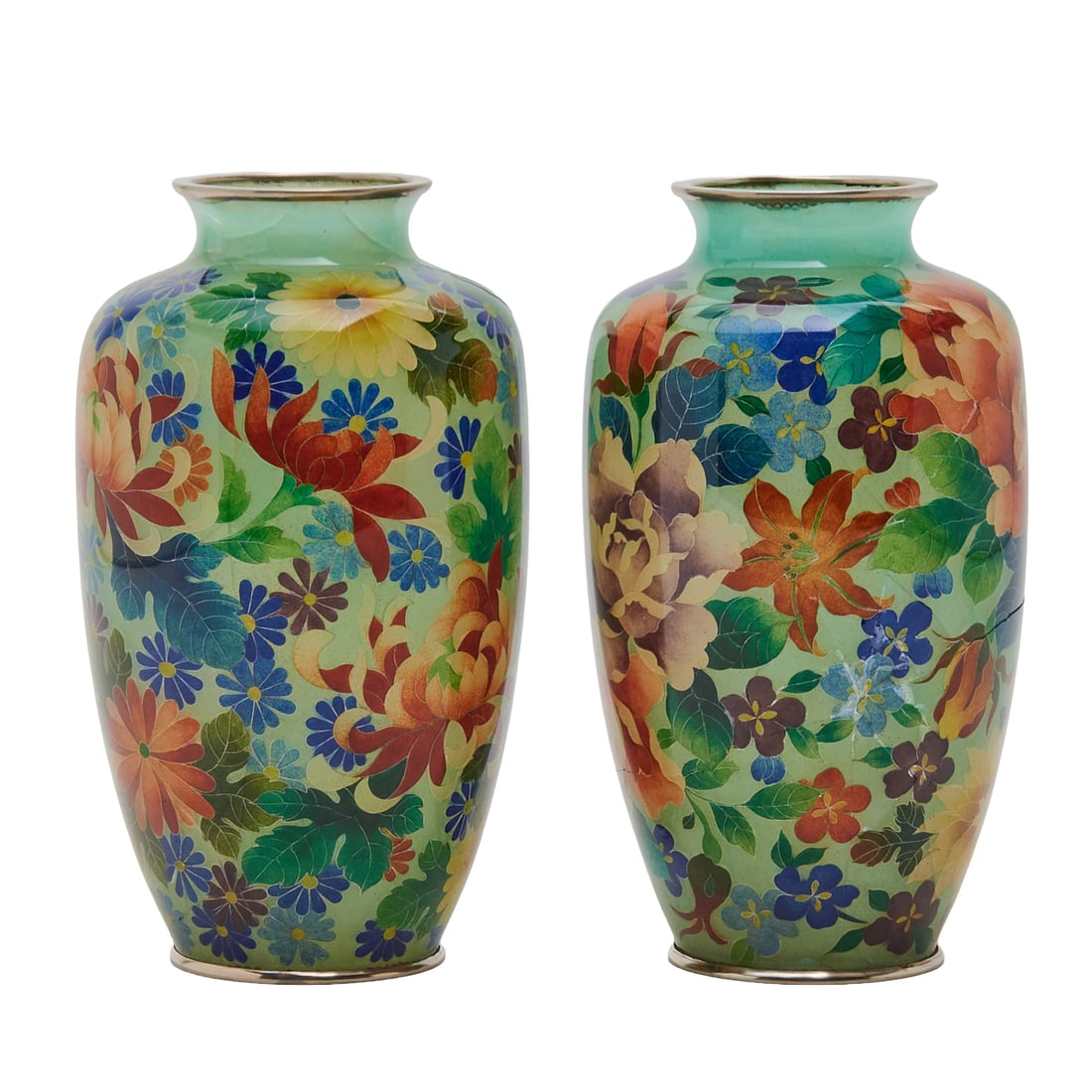 Pair of Japanese Floral Cloisonne Vases.: Pair of Japanese Floral Cloisonne Vases. Featuring a light green ground with colorful floral designs. The vases have a classic form and are decorated with chrysanthemums and other flowers in sha
