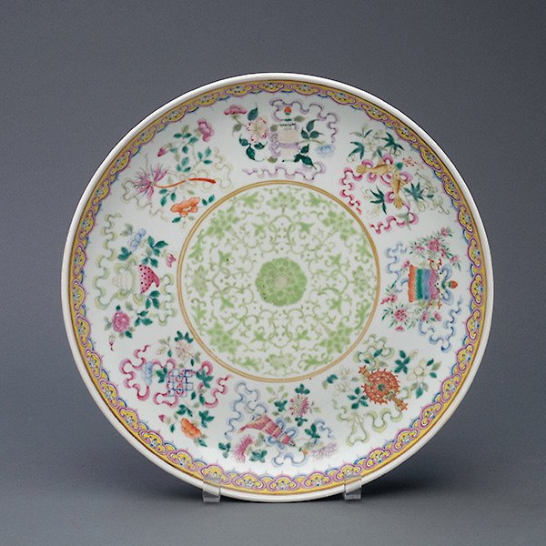 A Famille Rose Charger, Guangxu Mark and Period: A Famille Rose Charger, Guangxu Mark and Period, painted and gilt with a central roundel of a peony flower amongst leafy peony foliage, within a broad band of the eight Buddhist emblems, amongst spray
