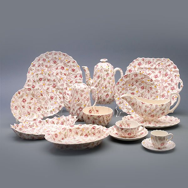 Spode Rose Chintz Dinner Service: Spode Rose Chintz Dinner Service: Including fourteen dinner plates (diameter 10 1/2 inches); eleven salad plates (diameter 8 inches); eight soup bowls; ten teacups (one larger); ten saucers (diameter 