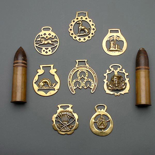 Collection of Eight Horse Brasses, and two shells: Collection of Eight English Horse Brasses and Two Ammunition Shells {Height of shell 6 1/2 inches}