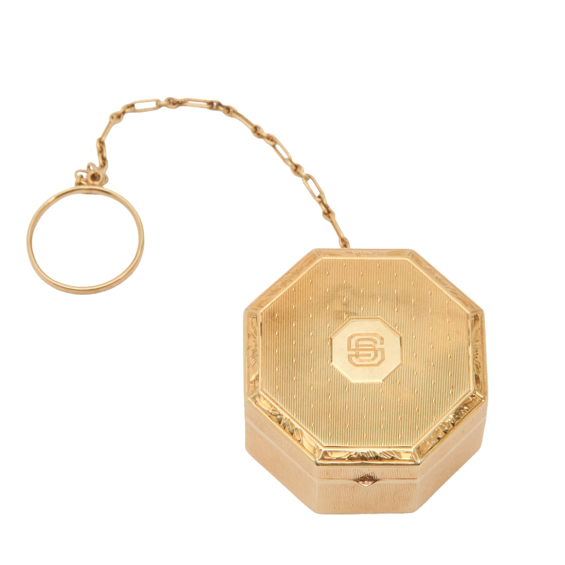14k Yellow Gold Octagonal Pill Box with Chain and Ring Attachment: 14k Yellow Gold Octagonal Pill Box with Chain and Ring Attachment.; Engraved decoration throughout,;SB monogram to lid; the interior with round plastic insert; 14K mark to interior rim.; {Approximate