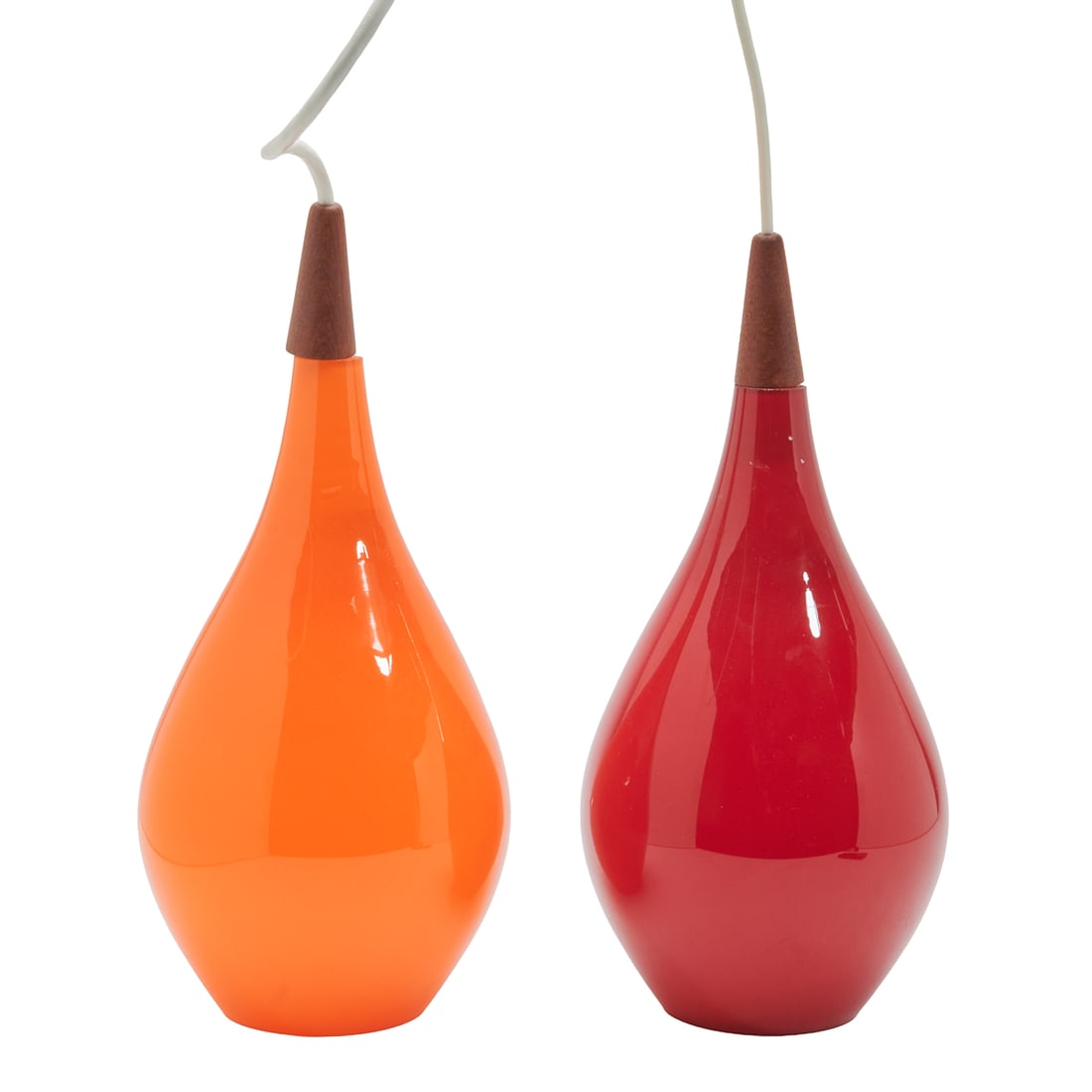 Two Danish Mid Century Modern Holmegaard Glass Pendant Lights: Two Danish Mid Century Modern Holmegaard Glass Pendant Lights.; Teardrop form single-light pendant fixtures, comprising red example and orange example, teak capped tops.; Cork stoppers to top with MAD