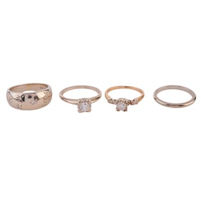 Collection of Four Diamond, 14k Yellow and White Gold Rings