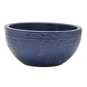 Chinese porcelain bowl featuring a rich blue glaze and embossed dragon