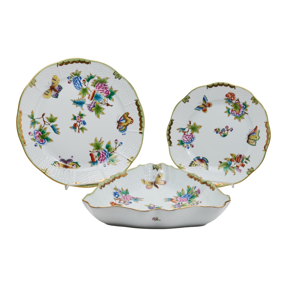 Herend Porcelain Dishes and Triangular Serving Bowl in Queen Victoria Pattern: Herend Porcelain Dishes and Triangular Serving Bowl in Queen Victoria Pattern.Comprising 6 dinner plates, 6 luncheon plates, and 1 trianglular serving dishor bowl, all painted with flowers and butterf