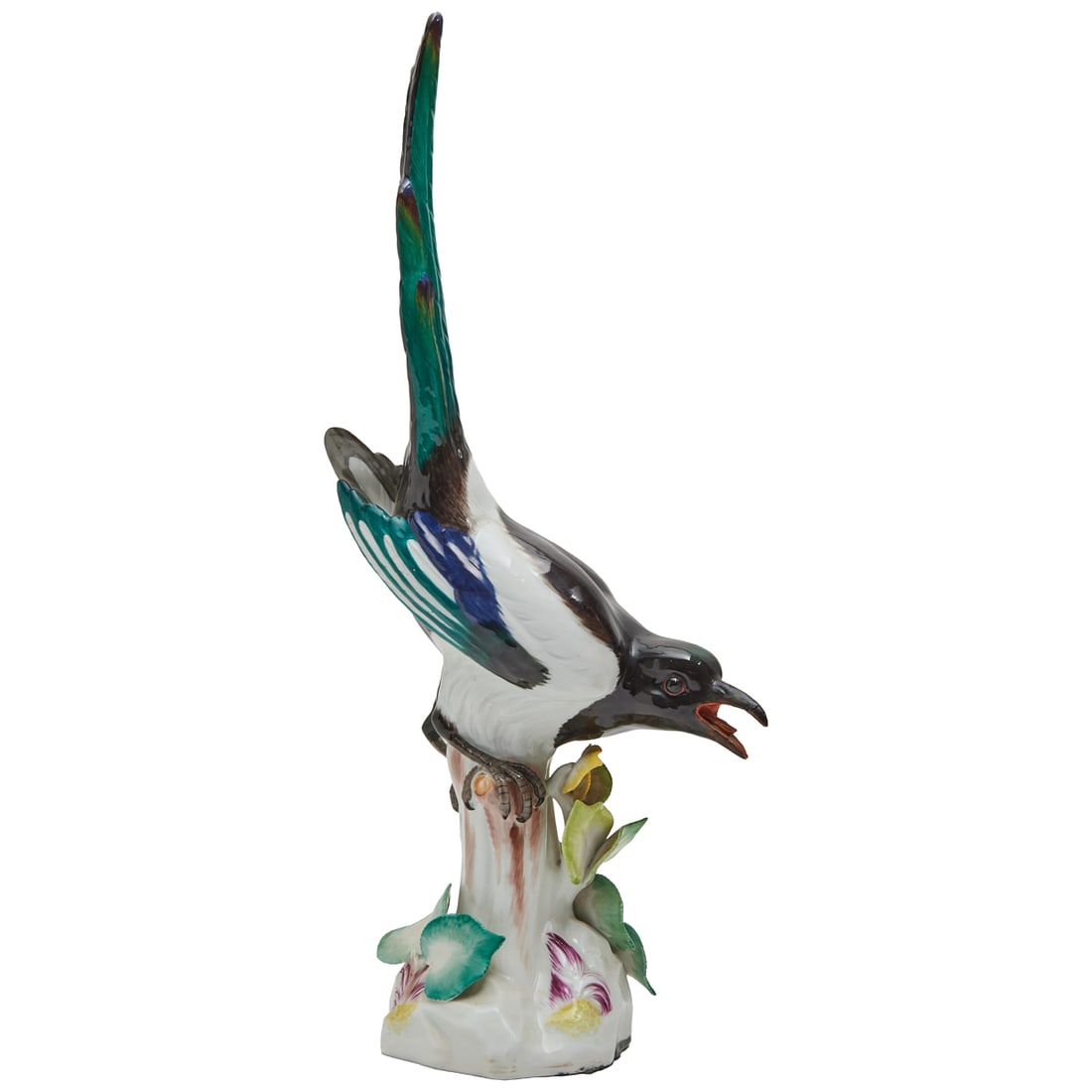 Meissen Porcelain Figure of a Magpie: Meissen Porcelain Figure of a Magpie, the calling bird modelled with upright feathers over the body of the bird, grasping a branch, on mounded base with leaves.Modelled after Johann Joachim Kaendler (
