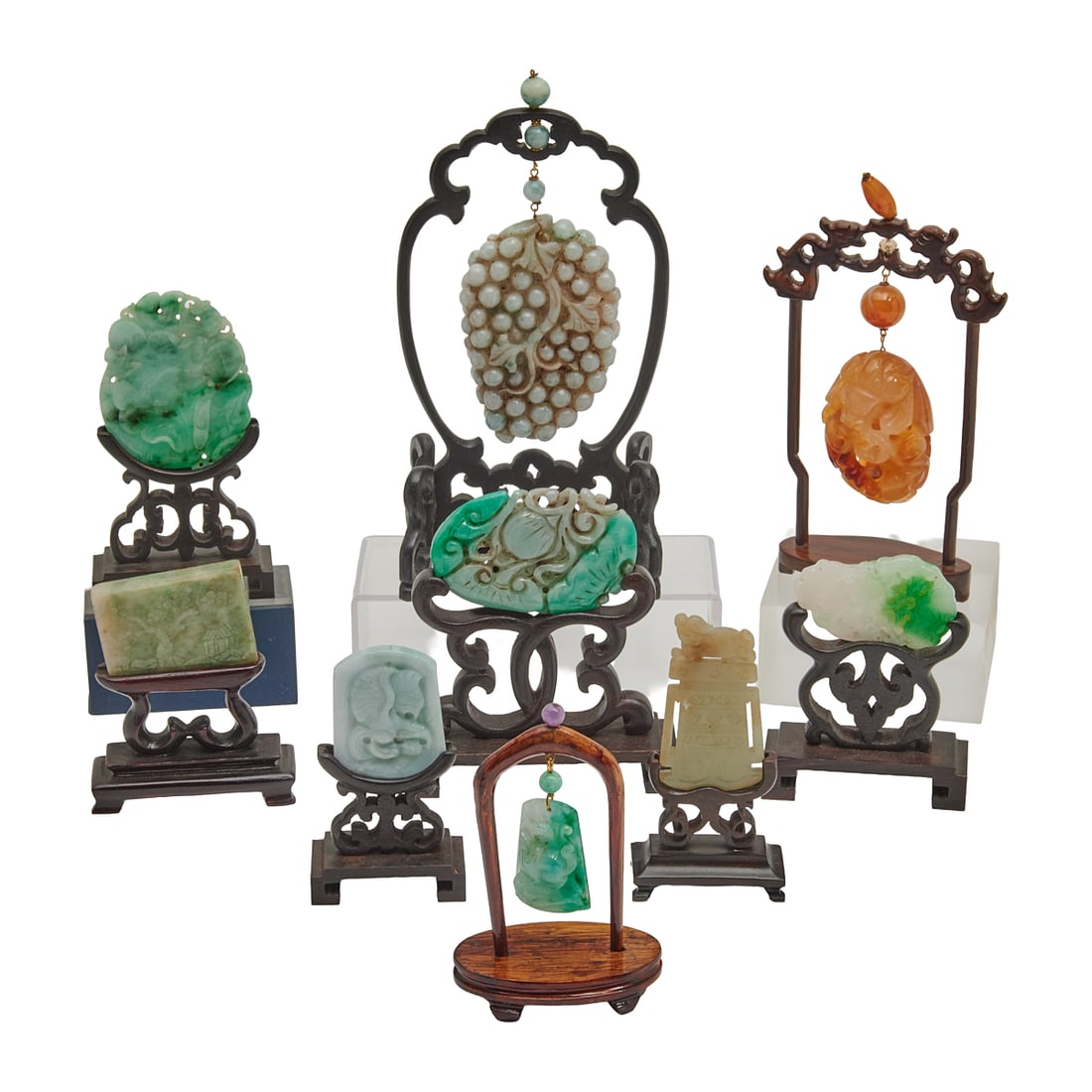 Collection of Chinese Jade and Jadeite Carvings on Base: Collection of Chinese Jade and Jadeite Carvings on Base.[Approximate Dimensions Largest Without Base - Height4 1/8 inchesx Width 3 5/8 inches x Depth 3/4 inches}.