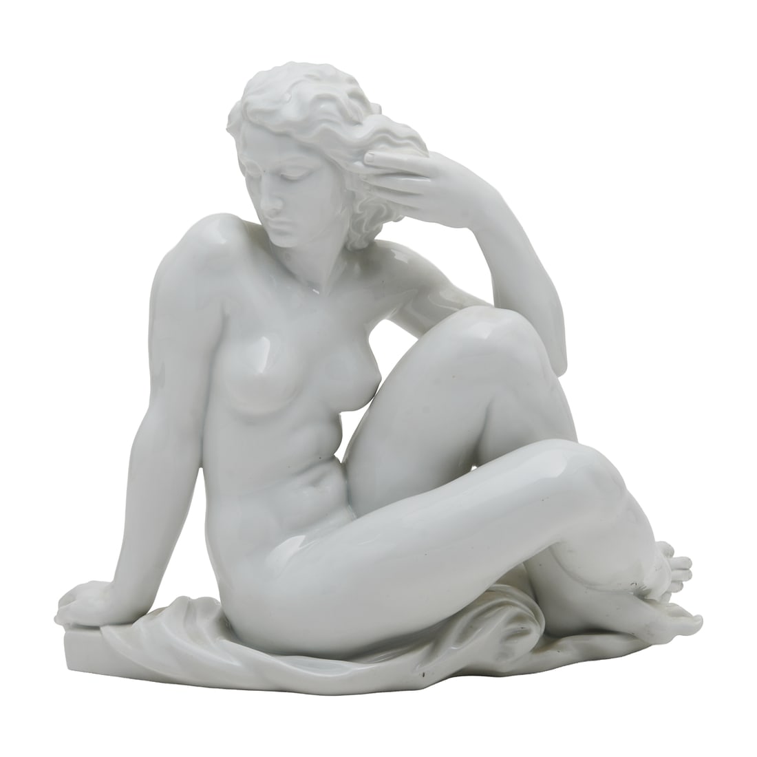Robert Ullman for Meissen Porcelain Sculpture of a Reclining Nude: Robert Ullman for Meissen Porcelain Sculpture of a Reclining Nude, atop a drapery base, leaning on her right arm, her left arm bent, hand in hair, face to side, bent knees, right toes splayed,. To bac